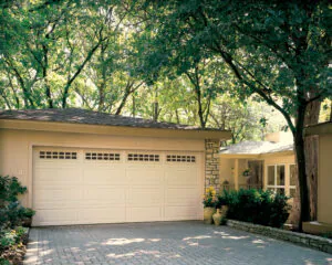 White garage door in wooded area