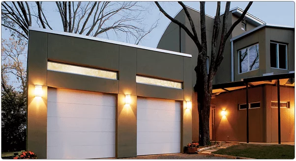 Two-car solid white garage door installation on modern home in Cincinnati.