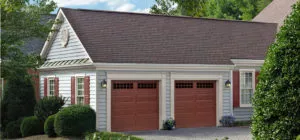 home with wooden double garage doors