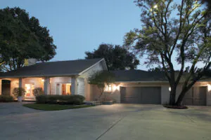 Modern home with illuminated garage entrance